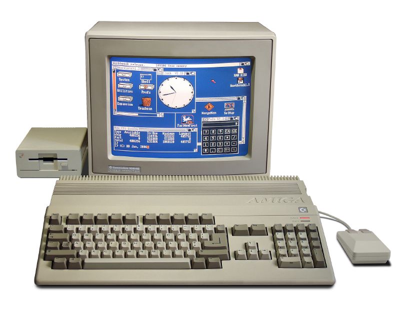A Commodore Amiga 500 with its monitor, disk drive, keyboard and mouse.